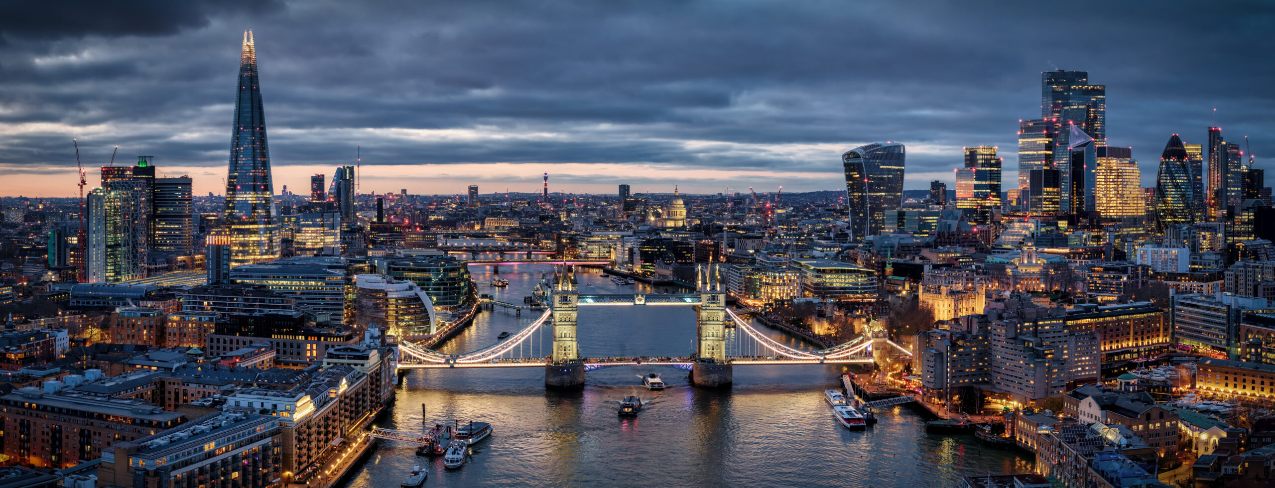 London skyline at twilight with Tower Bridge over the Thames