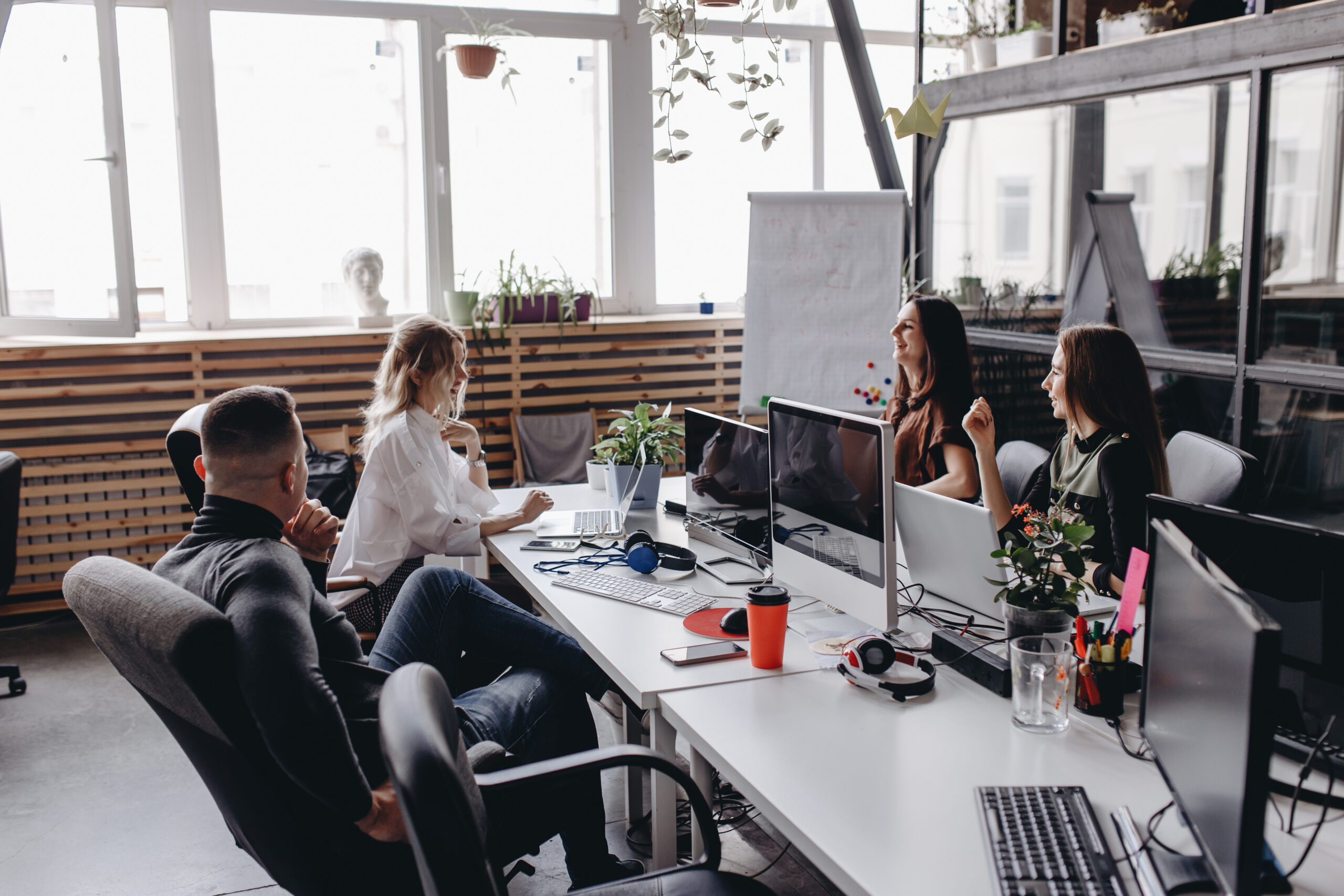 A young team working together in a spacious open-plan office