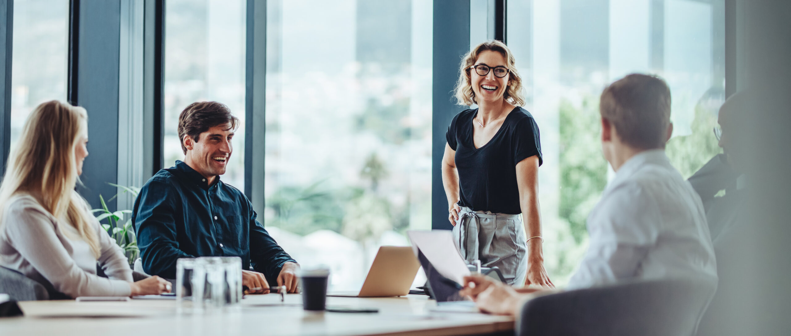 Group of business professionals in a productive discussion around a conference table